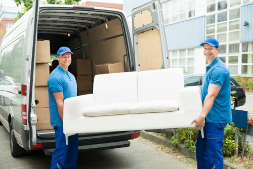 Furniture removals team loading household items in Maida Vale