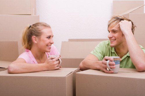 Professional movers handling furniture and packing for a Maida Vale property