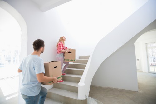 Moving boxes and furniture in a Maida Vale apartment building