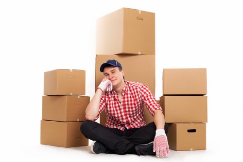 Local moving team handling household items near Maida Vale apartment buildings