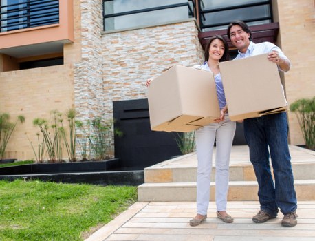 Team unloading office items at a new workspace